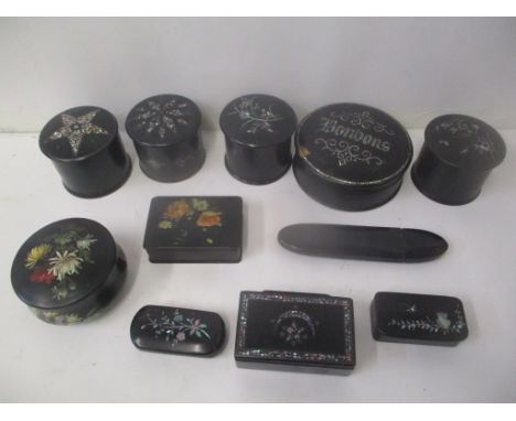 Black lacquered and mother of pearl inlaid boxes to include snuff boxes, trinket boxes and a glasses case 