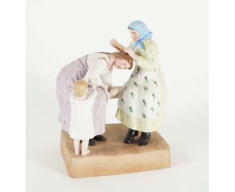 A RUSSIAN BISCUIT PORCELAIN FIGURE GROUP DEPICTING HAIR COMBINGGardner factory late 19th century, red printed mark, 17.5cm hi