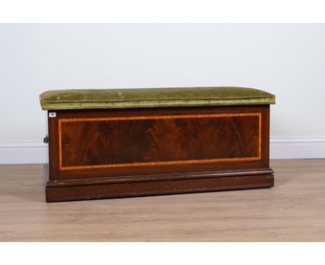 A LATE EDWARDIAN INLAID MAHOGANY LIFT TOP TRUNKWith upholstered seat, 120cm wide; 50cm deep; 52cm high