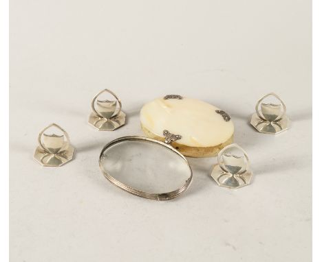 A SET OF FOUR SILVER PLACE NAME OR MENU STANDS AND A SILVER AND MOTHER-OF-PEARL OVAL MAGNIFYING GLASS (5)Each stand with a sh