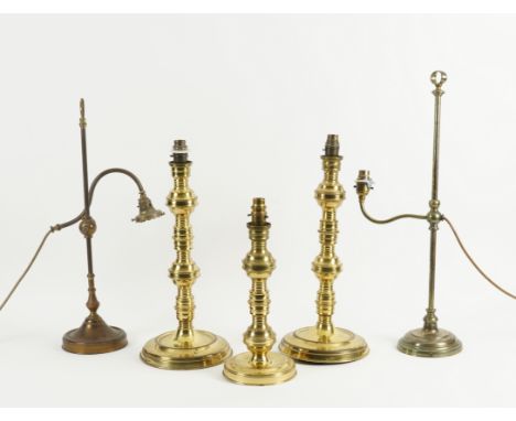 THREE BRASS LAQUERED METAL CANDLESTICK TABLE LAMPS (5)Modern Two a pair and a single with knopped shafts, 43cm high (no shade