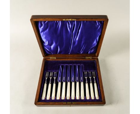 A SET OF SIX PAIRS OF DESSERT OR FRUIT KNIVES AND FORKSWith mother-of-pearl handles, all Sheffield 1914, with a wooden case, 