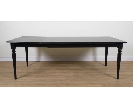 A CONTEMPORARY EBONISED EXTENDING DINING TABLEWith one extra leaf; 89cm wide; 155cm long; 218cm long extendedIkea dining tabl