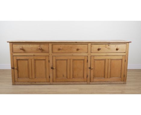 A LARGE VICTORIAN PINE DRESSER BASEWith three drawers over cupboards, 253cm wide; 53cm deep; 93cm highGood overall condition 