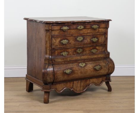 AN EARLY 19TH CENTURY DUTCH WALNUT BOMBE FOUR DRAWER COMMODE95cm wide; 55cm deep; 84cm highPlywood draw bases have been glued