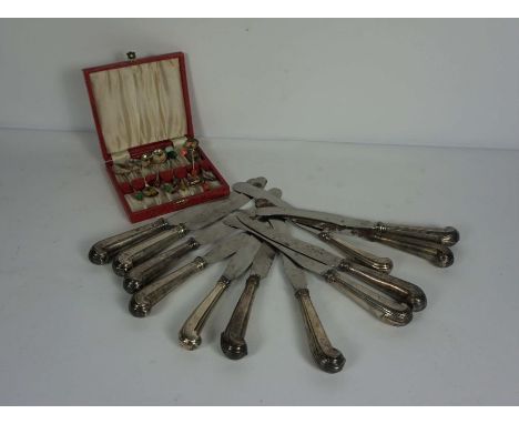 A set of twelve 19th century silver handled pistol grip table knives, the blades stamped Bullock, together with a large assor