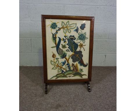 A firescreen, early 20th century, with an embroidered panel depicting a squirrel beneath colourful foliage and flowers, 79cm 