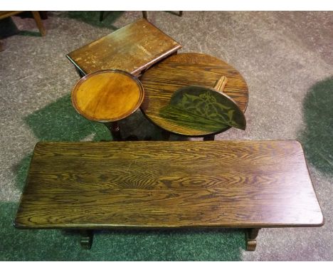 A small oak framed trestle table, modern, together with three other small occasional tables and a modern gothic style clock b