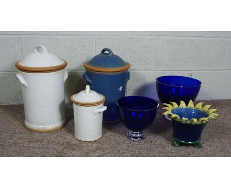 Two large stoneware covered kitchen jars, together with a similar smaller version, two large blue glass bowls and a planter i