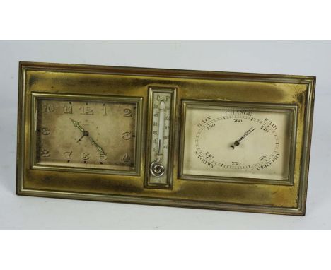 An Art Deco silvered brass cased desk alarm clock and barometer, with central thermometer, the support inscribed Goldsmiths &