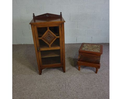 A late Victorian pier cabinet, circa 1890, with a glazed single door opening to three shelves; together with a small pot comm