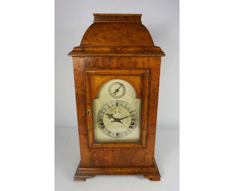 A George II style walnut cased bracket clock, with paper label for W.Drury, Sussex, circa 1910, with silvered arched dial, su