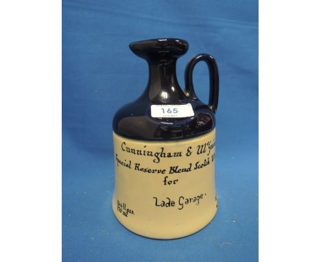 A ceramic decanter of Cunningham and McGuire's special reserve blend scotch whisky, made for Lade Garage