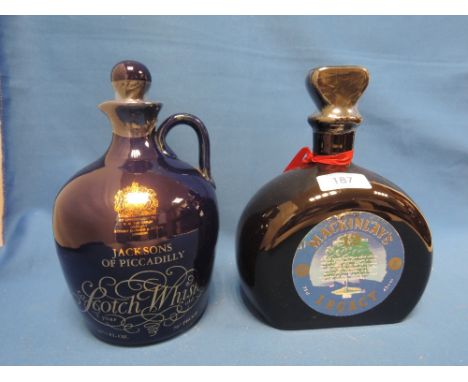 Two ceramic decanters of whisky. A MacKinlay's 12 year old legacy, and a Jacksons of Piccadilly scotch whisky 7 year old, twe
