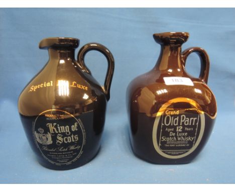 Two ceramic decanters of whisky. A Grand Old Parr 12 year old deluxe scotch whisky, and a King of Scots special deluxe blende