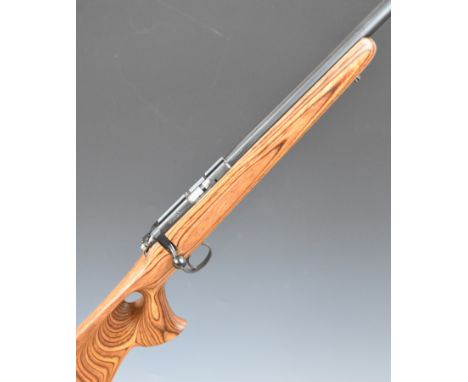 CZ 455 .17HMR bolt action rifle with laminated show wood stock, thumb hole grip, raised cheek piece, multi-shot magazine, sli