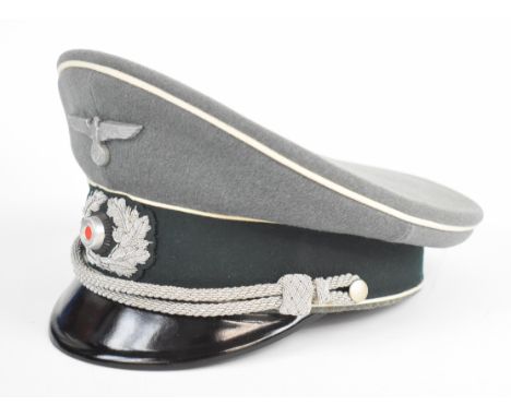German WW2 Nazi Third Reich Officer's peaked cap with silver wire bullion badge, chin cords and metal eagle badge