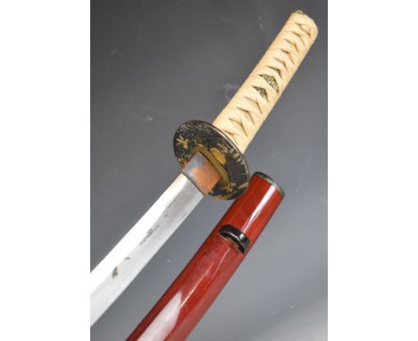 Japanese Samurai sword with bound grip, two menuki, decorated tsuba, 62cm curved blade and scabbard.&nbsp;PLEASE NOTE:- Befor