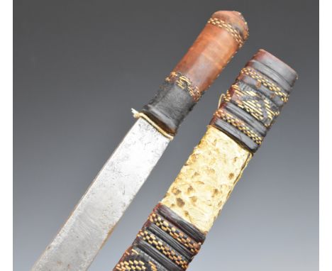 African Tribal short sword with leather covered grip,&nbsp;49cm single edged blade and skin and leather covered scabbard.&nbs