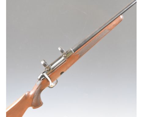 Tikka M595 .243 Winchester bolt-action rifle with&nbsp;chequered semi-pistol grip and forend, raised cheek piece, sling and s