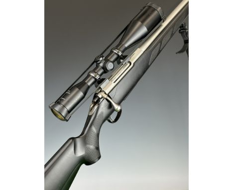 Tikka T3 .223 Remington bolt-action rifle with composite stock, textured semi-pistol grip, neoprene sling, Schmidt &amp; Bend