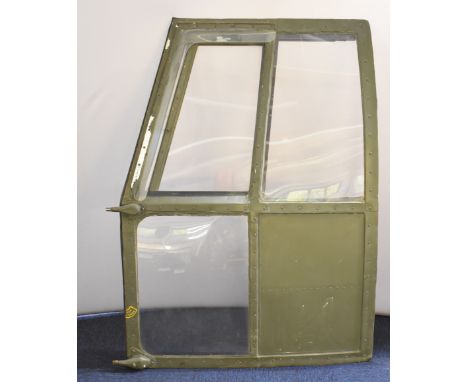 Royal Air Force Puma helicopter cockpit door retaining its perspex panels and document pouch, 90 x 124cm