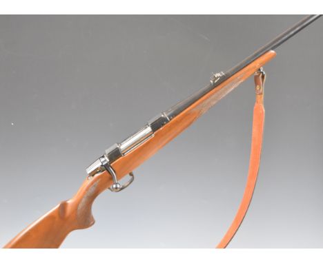 CZ 550 .243 bolt-action rifle with chequered semi-pistol grip and forend, leather sling, adjustable sights and 24.5 inch barr
