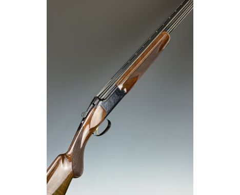 Browning Citori 20 bore over and under ejector shotgun with named underside, engraved locks, chequered semi-pistol grip and f