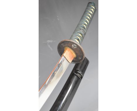 Japanese short sword with bound grip, signed tang, two menuki, circular guard, copper habaki, 96cm curved blade with distinct