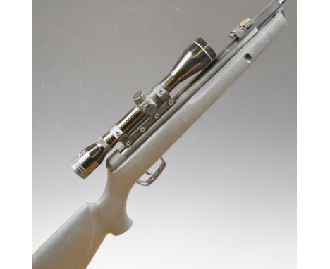 Gamo Hornet .22 air rifle with textured semi-pistol grip, raised cheek piece, composite stock, adjustable sights and Tasco Si