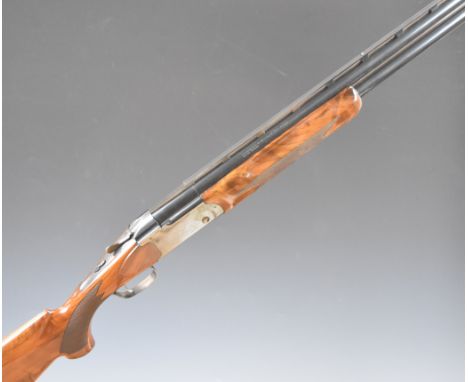 Remington 3200 Special Trap 12 bore over and under ejector shotgun with engraved scenes of dogs to the locks, chequered semi-