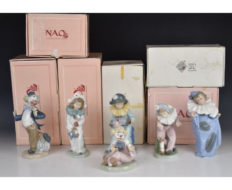 Six Nao clown figures with puppy, dove, accordion etc, all boxed, tallest 21cm