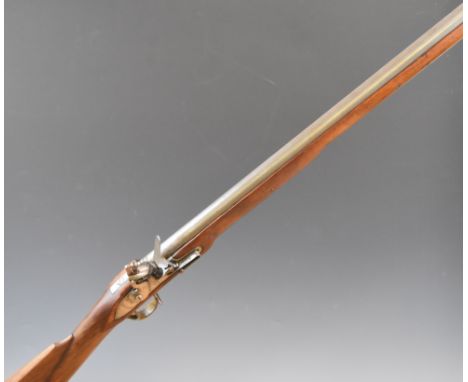 10 bore flintlock muzzle loading gun with 'Tower' and crown over 'GR' cypher to the lock, brass trigger guard and butt plate,