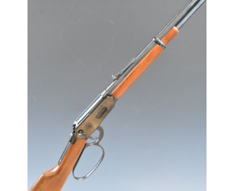 Deactivated Winchester model 94AE .45 Colt underlever action rifle with adjustable sights and 20 inch barrel, overall length 