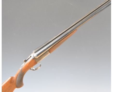 SKB Model 200E 12 bore side by side ejector shotgun with engraved lock, trigger guard, underside, top plate, thumb lever and 