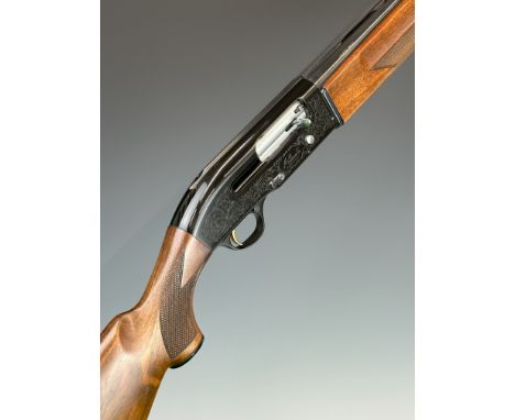 Beretta A302 12 bore three-shot semi-automatic shotgun with named and engraved locks, chequered semi-pistol grip and forend, 