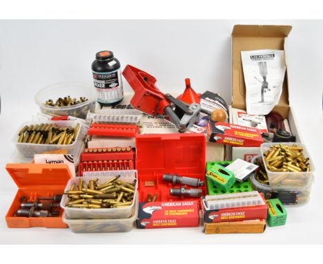 A collection of rifle or shotgun cartridge re-loading equipment including Lee Challenger Press Kit, Lee Powder Measure, .223 