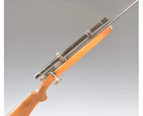 Winchester Model 69 .22 bolt-action rifle with semi-pistol grip, military style scope and 25 inch barrel, overall length 106.