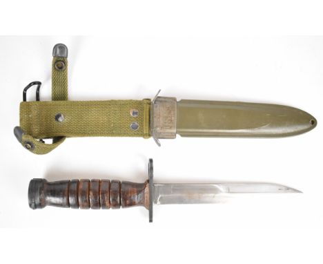 American fighting knife with leather grip, 17cm part double edged blade, scabbard marked U.S M8 B.M Co and integrated belt at