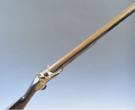 Unnamed 10 bore flintlock muzzle loading gun with engraved lock, trigger guard and butt plate and 33.75 inch smooth bored bar