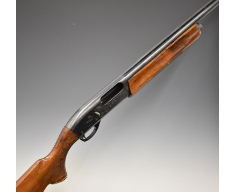 Remington Model 1100 Trap 12 bore 3-shot semi-automatic shotgun with ornately carved and chequered semi-pistol grip and foren
