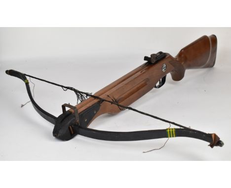 Barnett Wildcat crossbow with wooden stock, chequered semi-pistol grip and adjustable sights.&nbsp;