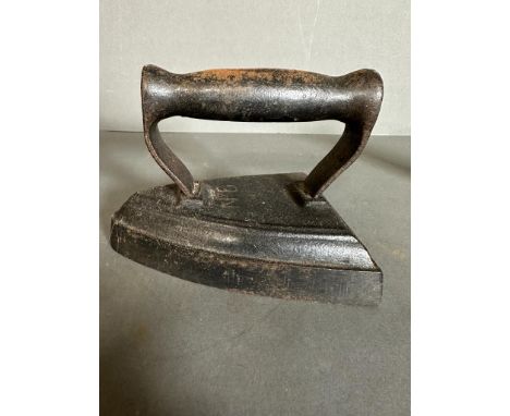 Two vintage cast iron irons and a iron trivel 