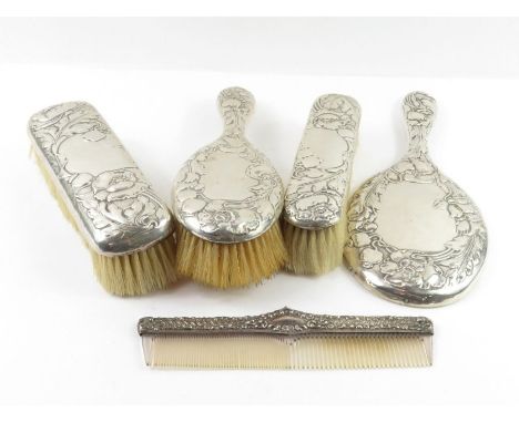 A silver dressing table set comprising hand mirror, hair brush and two clothes brushes, Birmingham 1901, Horton &amp; Allday,