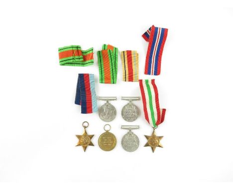 A collection of WWI and WWII medals to include a Victory Medal named - 31509 PTE F C TIVEY LEIC R; the Africa Star; the Italy