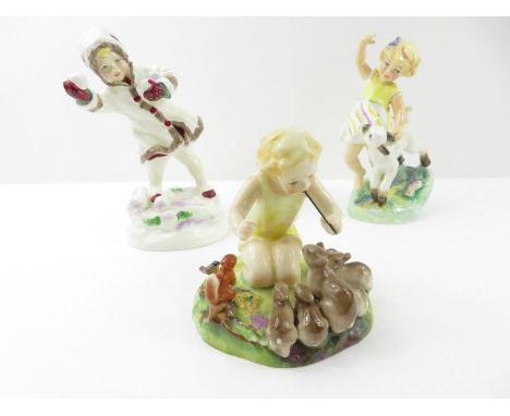 A Royal Worcester figure 'Woodland Dance'; and two Royal Worcester figures - April and December