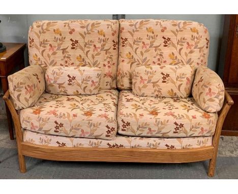 An Ercol elm Renaissance sofa and single armchair