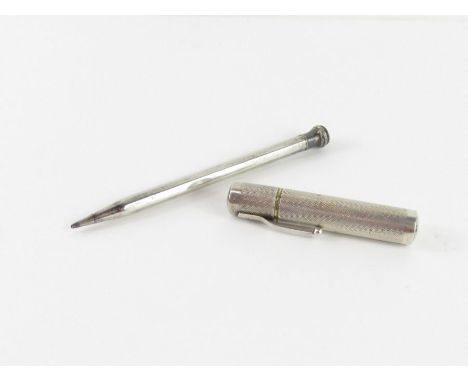 A Colibri cigarette lighter, stamped ‘Sterling Silver’ and with a lion passant mark, in the form of an engine turned stubby p