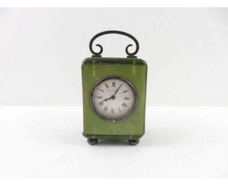 A 20th century miniature mantel clock, with green bakelite case, the white enamel dial marked C Packer, with silver hallmarke