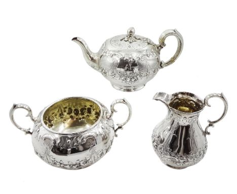 Victorian silver three piece tea service, embossed floral and swag decoration by Henry Wilkinson &amp; Co, London 1862, appro